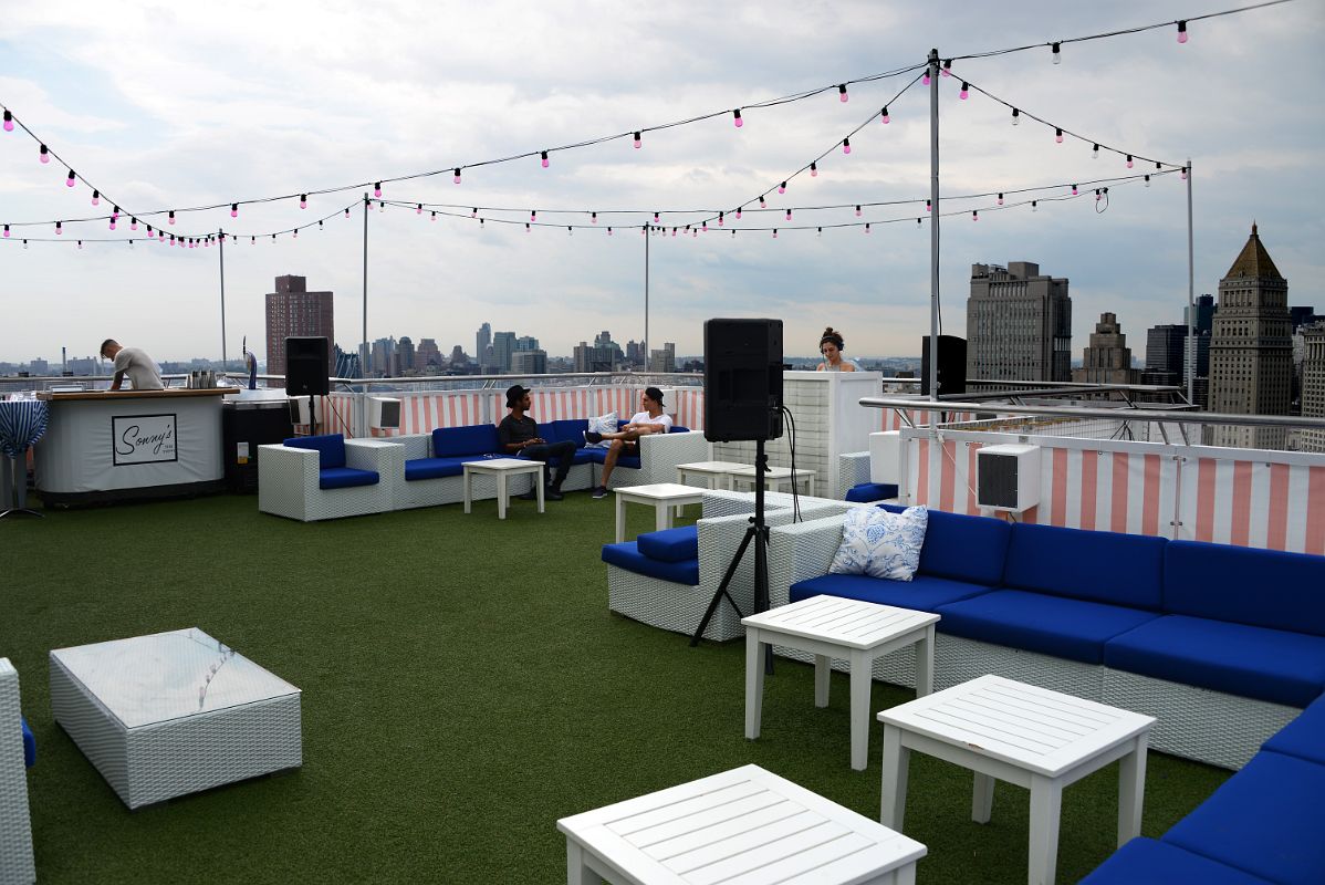 07-06 Outdoor Bar And DJ With View To Brooklyn And Financial District From The Rooftop At NoMo SoHo New York City
